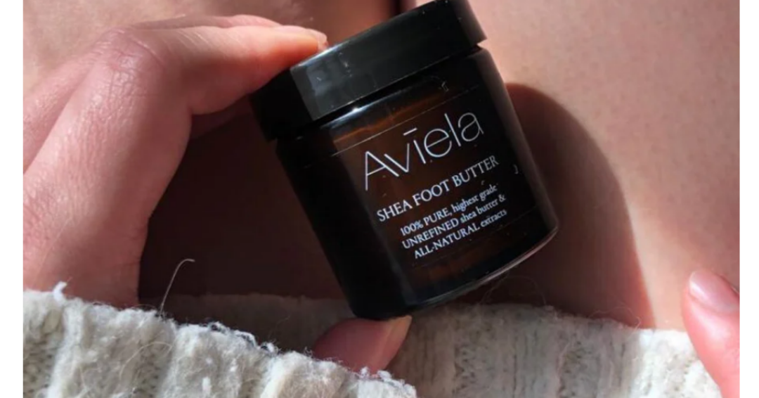 Close up image of person holding Aviela Shea foot butter